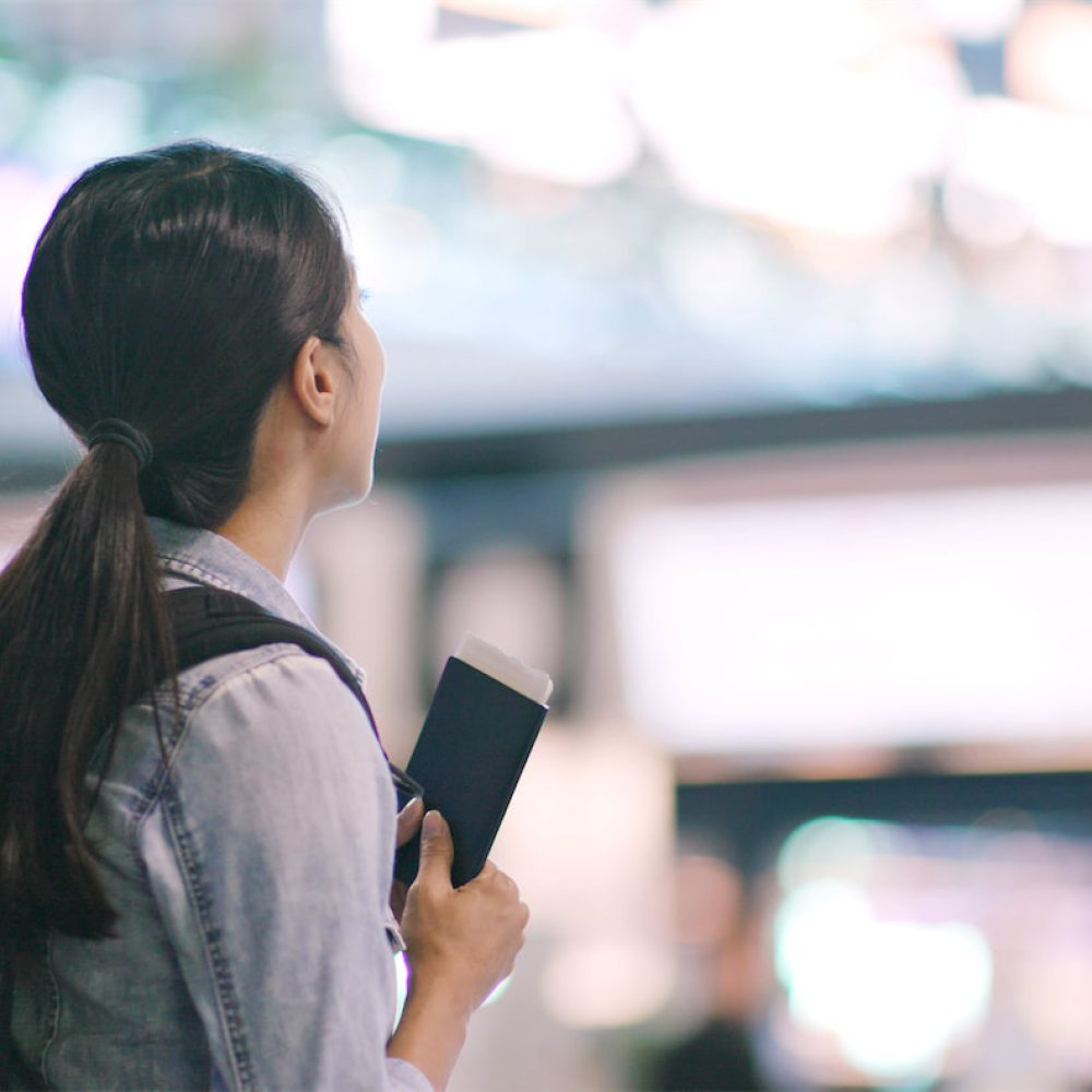 travel-woman-looking-at-the-display-board-in-the-a-2022-09-16-03-42-41-utc X1500 travel-woman-looking-at-the-display-board-in-the-a-2022-09-16-03-42-41-utc X1500